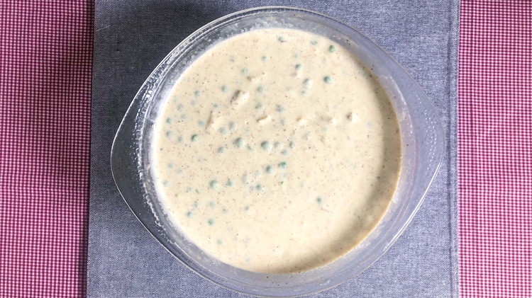 Image of Combine soup mixture, cream, and peas. If using frozen peas, make sure they are defrosted and drained before adding to the mixture.