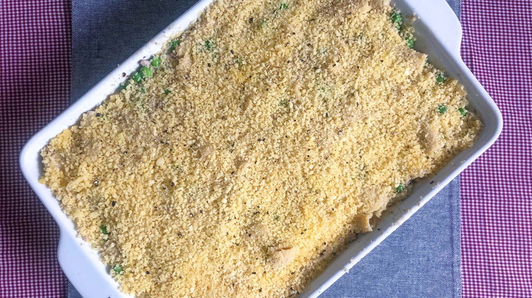 Image of Transfer noodles to 9x13in a casserole pan. Mix bread crumbs with melted butter and layer on top of the casserole.