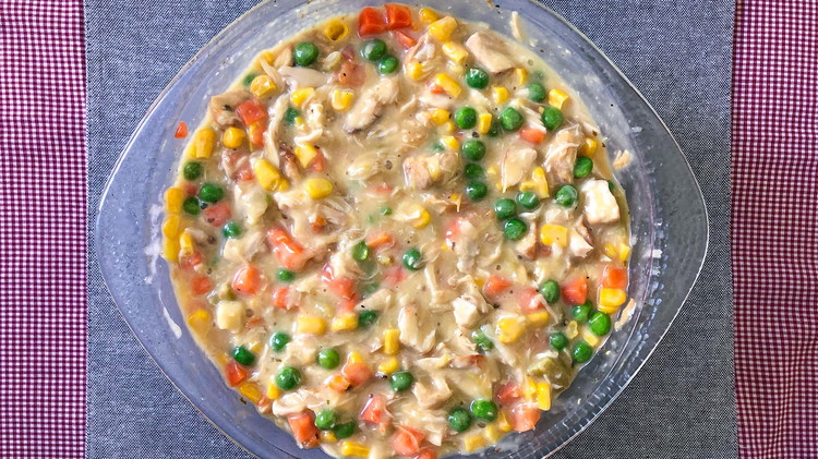 Image of Prepare stuffing mix according to package directions. Set aside. In a separate bowl mix chicken, cream of chicken soup, and cream of celery soup. Add vegetables to chicken and mix (if using frozen vegetables make sure they are defrosted and...