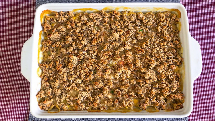 Image of Pour chicken and vegetable mix into greased 9×13 pan. Prepare the stuffing mix according to package direction and top casserole.