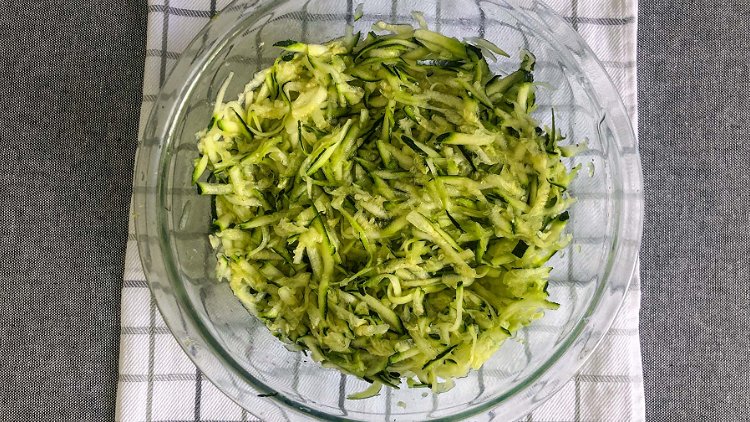 Image of Start by preheating the oven to 350°. Grate zucchini and...