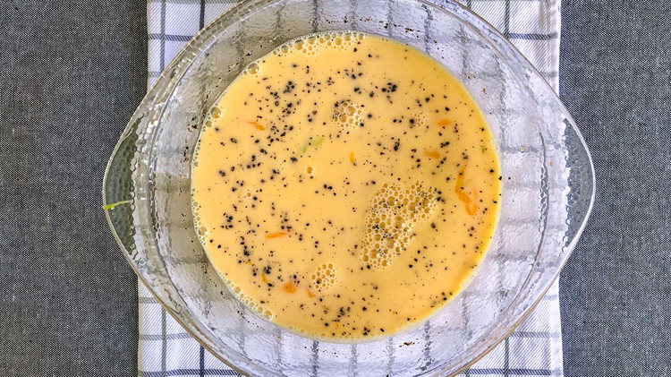 Image of In a large mixing bowl, whisk eggs, milk, and salt and pepper.