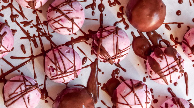 Image of Drizzle melted chocolate over the tops of each fat bomb.