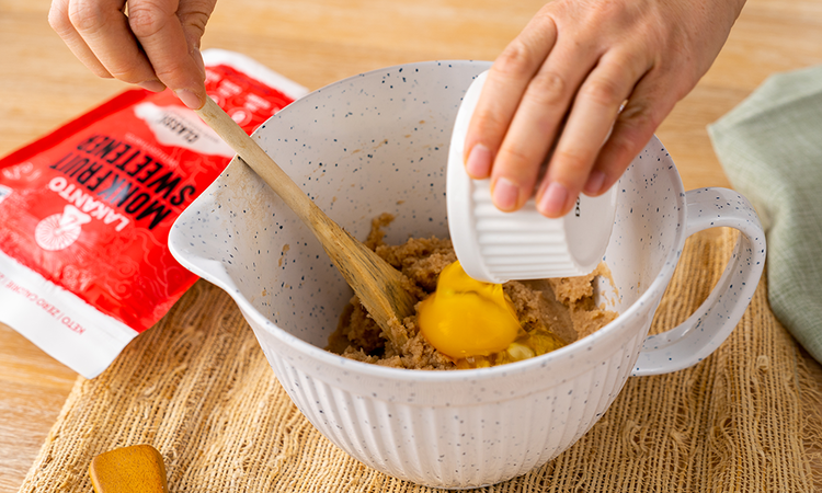 Image of Once mixed, add the egg and stir until the mixture forms a ball of dough.