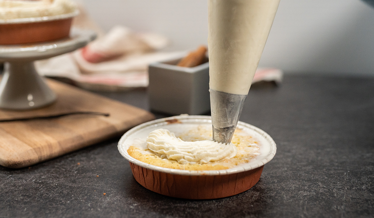 Image of Pipe the whipped cream on your Tres Leches Cake.