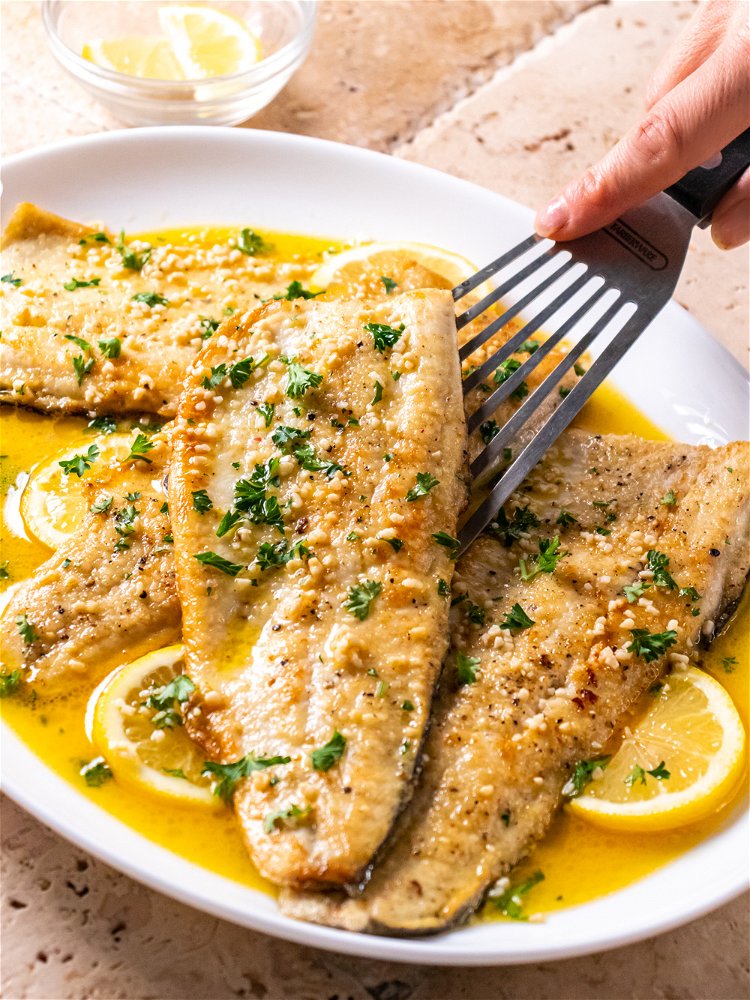 Image of Add lemon wedges to pan and top with parsley. Serve...