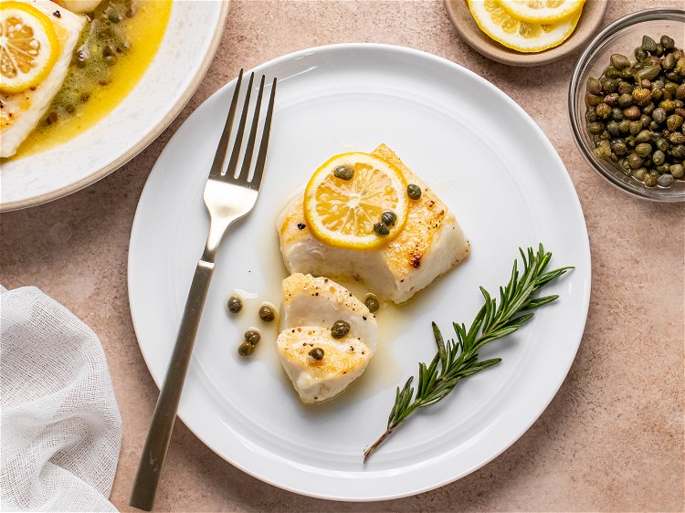 Image of Serve hot garnished with lemon slices.