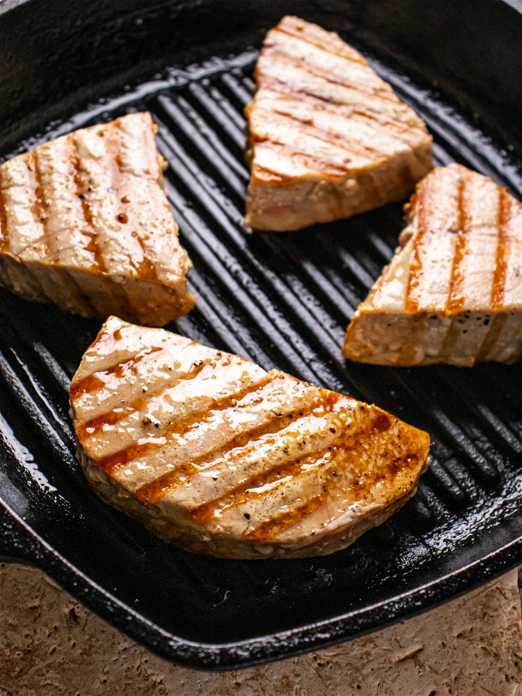 Image of When grill pan is very hot, place tuna portions on...