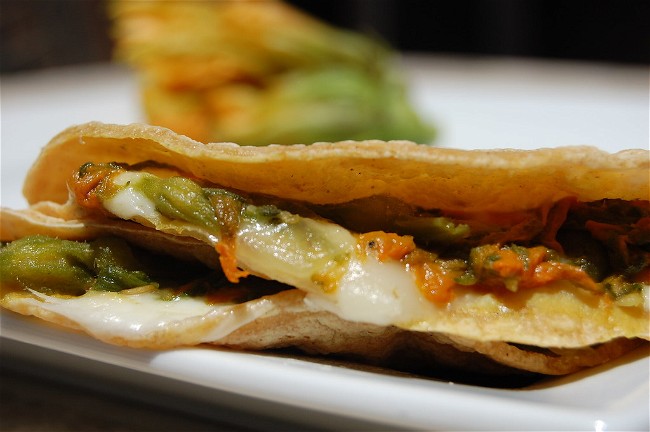 Image of Quesadillas de flor de calabaza (tortillas filled with squash blossoms and cheese)