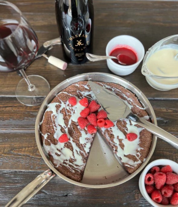 Image of Flourless Chocolate Torte with Vanilla Drizzle & Raspberries