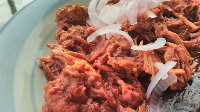 Image of Cochinita pibil (pulled pork marinated in achiote and citrus juice)