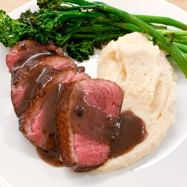 Pan seared duck breast with berry sauce