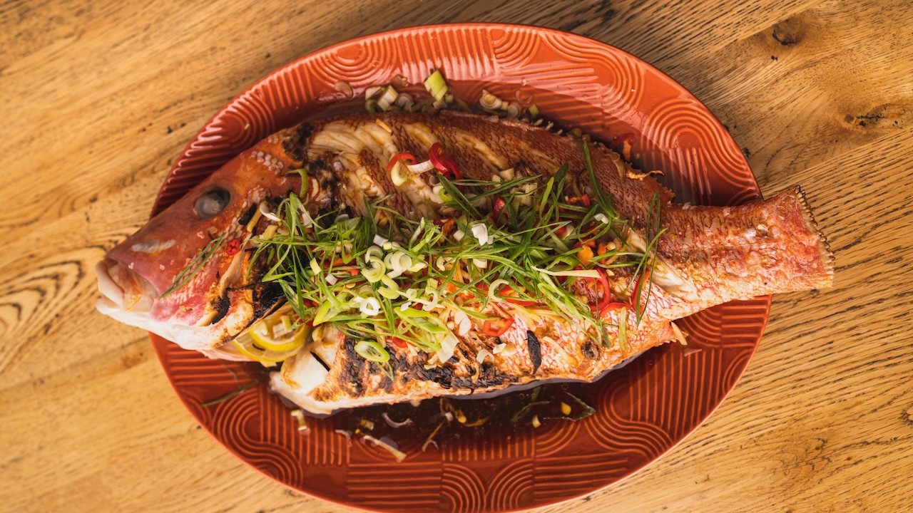 Image of Whole roast fish with yuzu, ginger and lemongrass