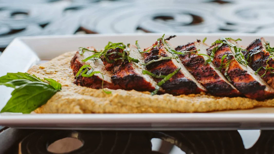 Image of Grilled Pork Tenderloin with Roasted Red Pepper Hummus