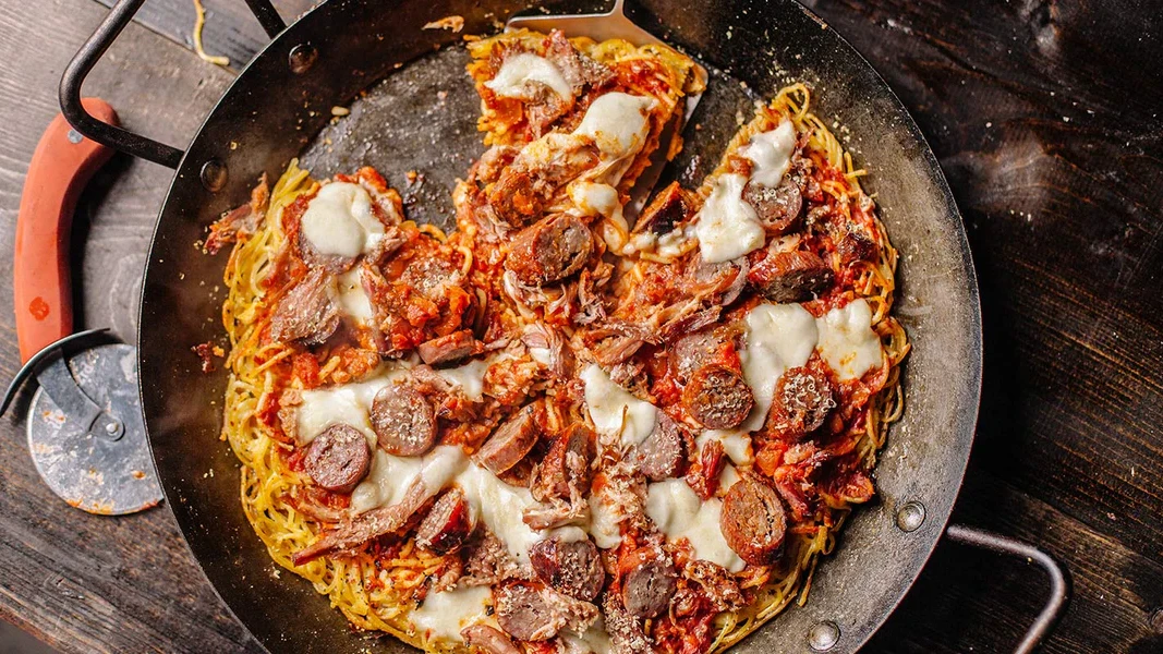 Image of Spaghetti Pizza with Pulled Pork and Italian Sausage
