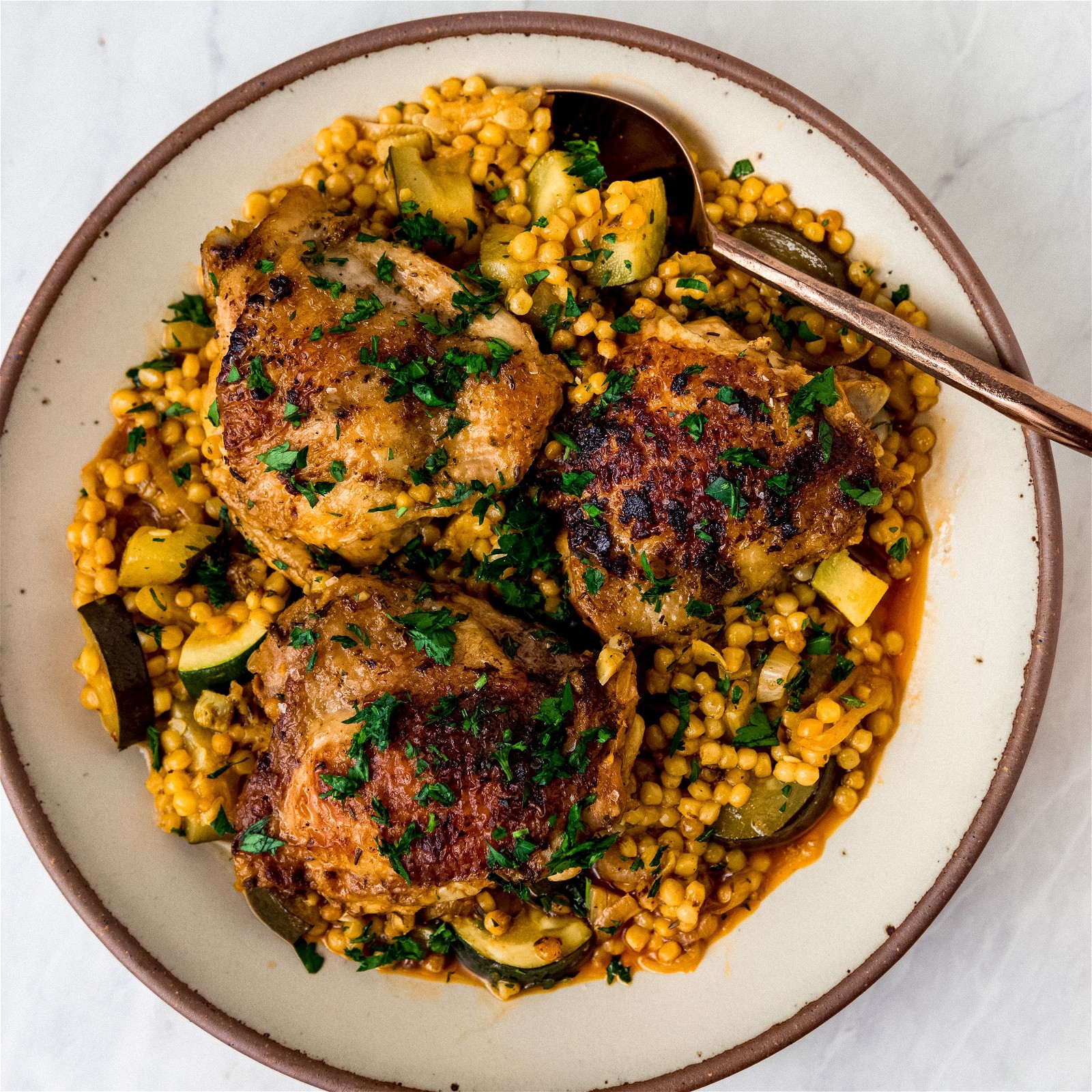 Image of Garlic-Lemon Chicken with Saffron Pearl Couscous and Zucchini