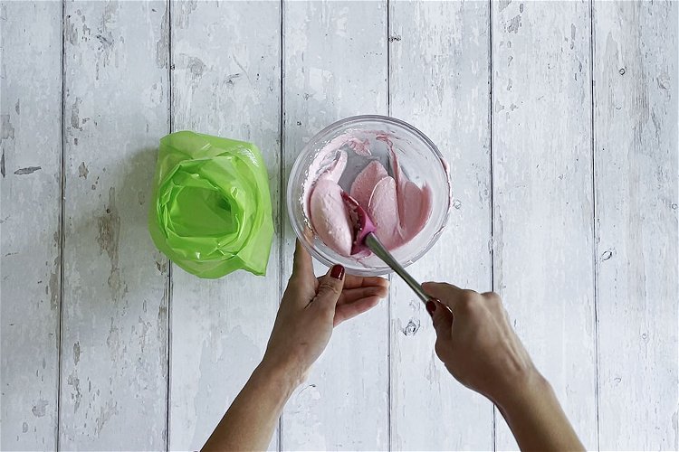 Image of Place the piping bag pointy end down, into a tall...