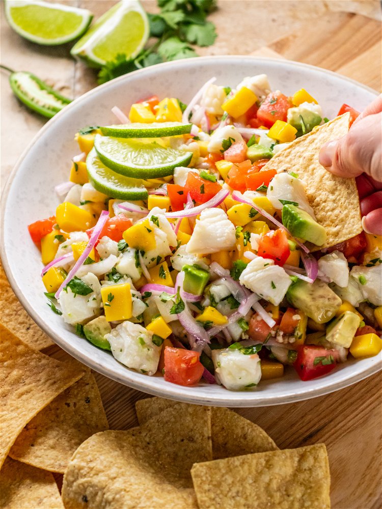 Image of Serve ceviche immediately with tortilla chips or refrigerate and serve...