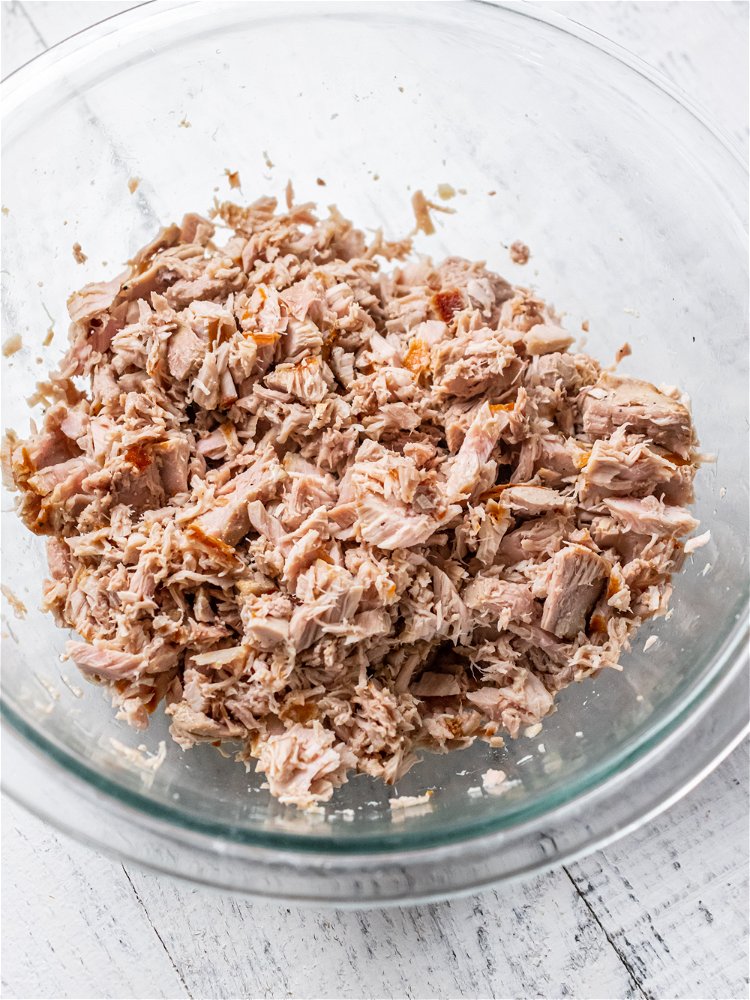 Image of Transfer to a cutting board and shred tuna with 2...