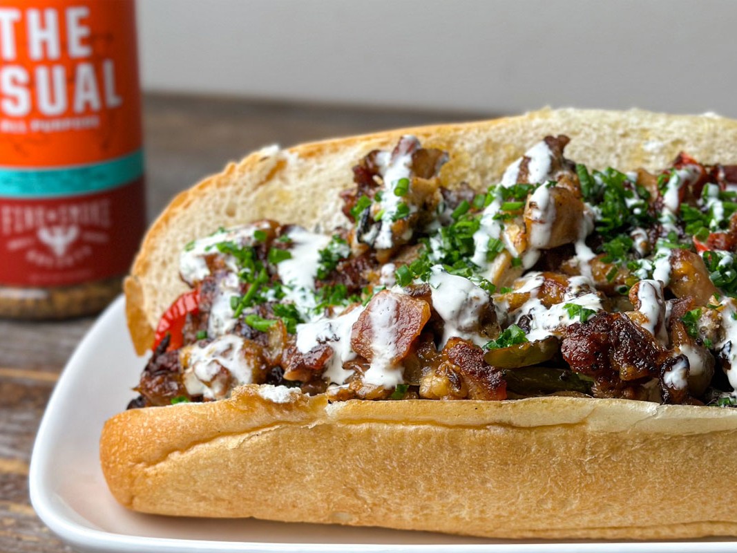 https://images.getrecipekit.com/20230428155857-chicken-bacon-ranch-philly-cheesesteak-recipe-with-the-usual-seasoning.jpg?aspect_ratio=4:3&quality=90&