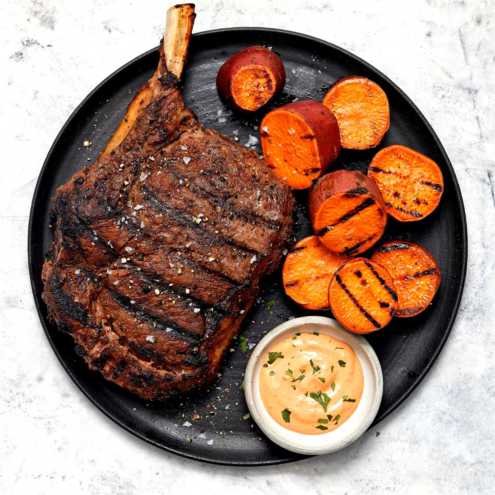 Image of Dusted Cowboy Ribeye Steak with Chipotle Crema and Grilled Sweet Potatoes