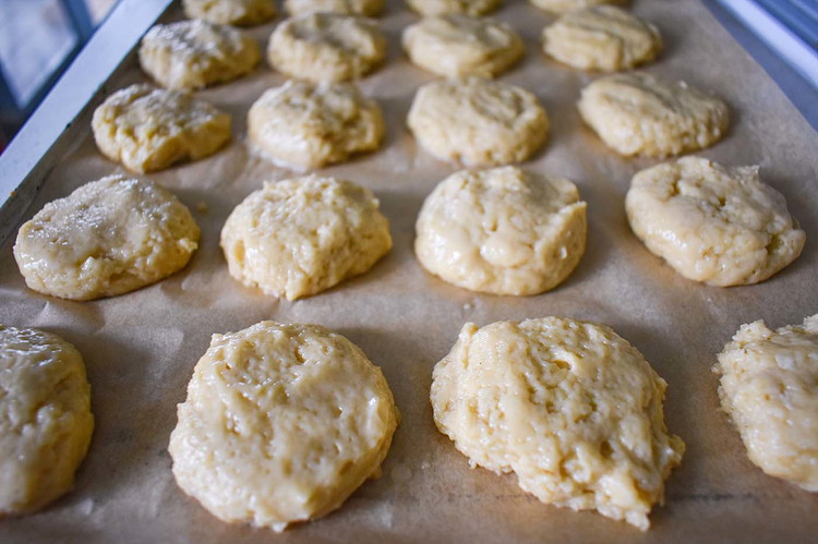 Image of Place cookies on a lined baking tray at least 2 inches apart. Bake at 375° for 10- 15 minutes until edges are lightly browned.