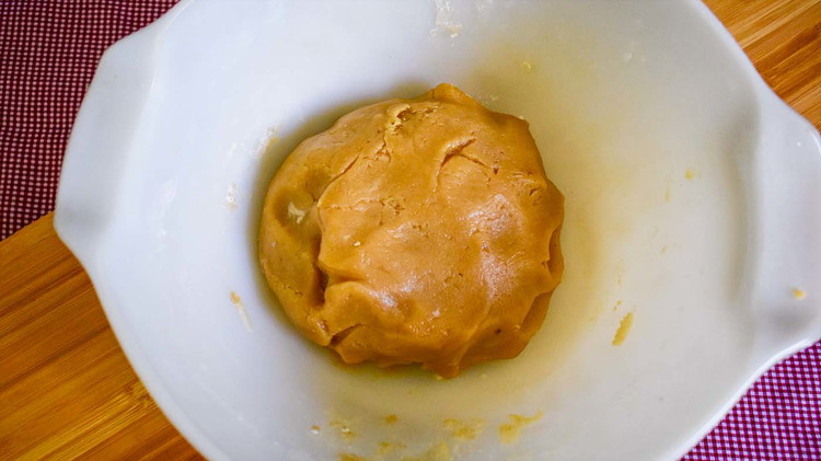 Image of For the cookie dough: First cream together the shortening then add the rest of the ingredients (eggs, vanilla, baking soda, and flour). Form a ball of dough.