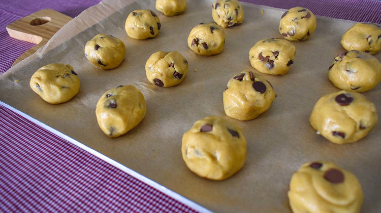 Image of Roll tablespoon size balls of dough. Place on a greased cookie sheet or parchment paper.