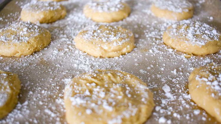 Image of Powder with powdered sugar. Bake at 350 for 10-12 minutes. Increase bake time for crunchier cookies.