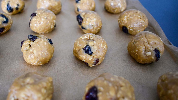 Image of Drop rounded teaspoons of dough on a covered or greased baking tray. For flatter cookies, flatten balls of dough with a teaspoon and minimize baking time by 2-3 minutes.