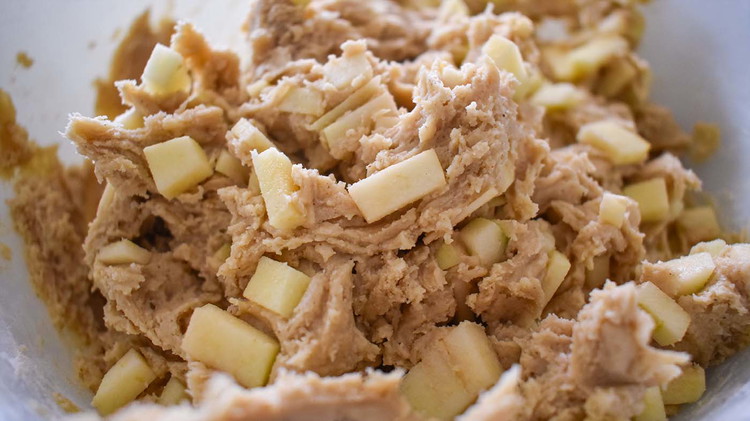Image of Fold apples into the mixture.