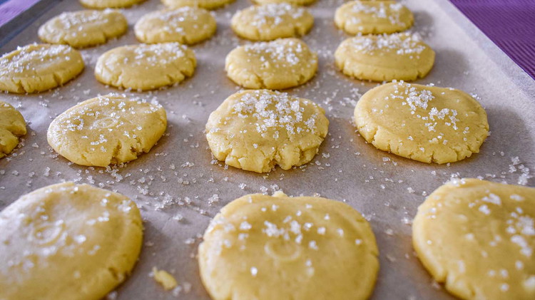 Image of Flatten balls to 1/4-inch thick with the bottom of the glass dipped in sugar. Bake 10-12 minutes at 350° or until edges are lightly browned.