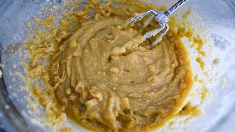 Image of Cream margarine and peanut butter. Add eggs and combine well. Then cream the peanut butter mixture with sugar.