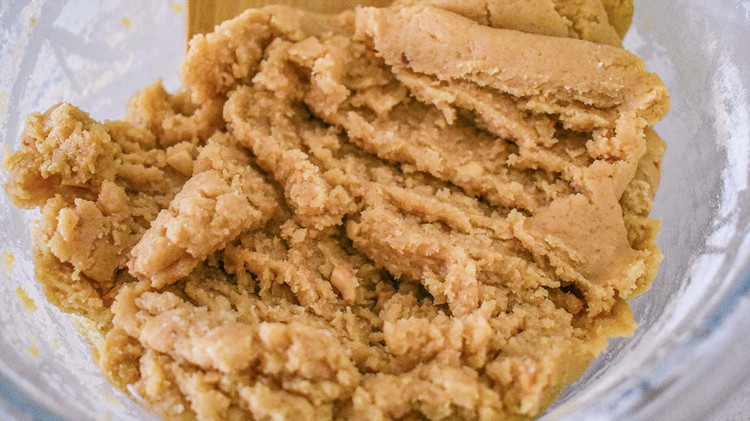 Image of Sift flour with salt and baking soda. Add to the peanut butter mixture. Combine well and add vanilla.