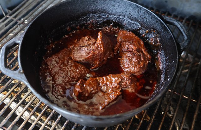 Image of Place the smoked beef cheeks in the dutch oven, pour...