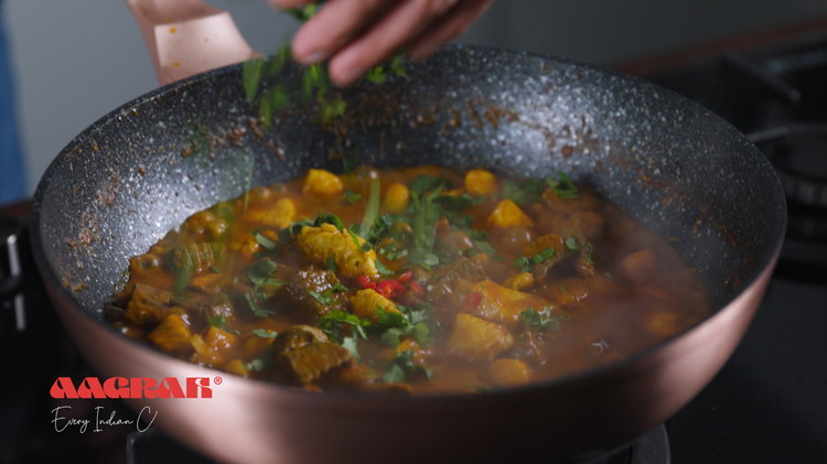 Image of Add the chopped chillies, chopped coriander (save some to garnish at the end) and the garam masala.