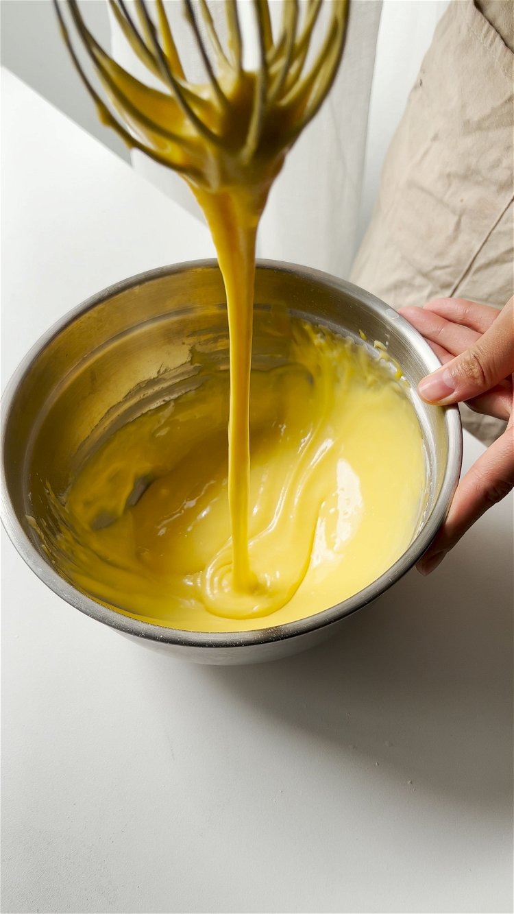 Image of Add in cake flour, mix until smooth. Add in egg...