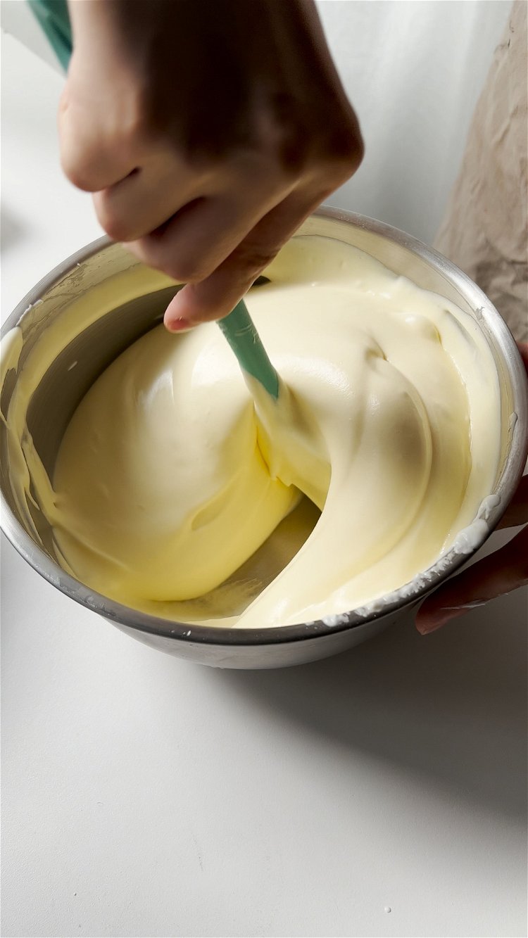 Image of Take a scoop of whipped egg white to mix with...