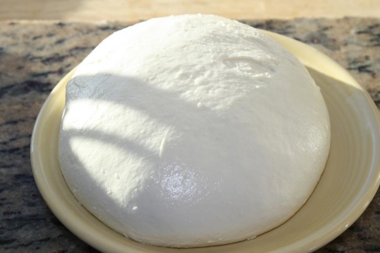 Image of Once the curds have drained for 2 minutes, place them in a microwave proof bowl and heat them for 30 seconds. They will be very hot so you may want to use gloves at this stage. Salt the curds with...