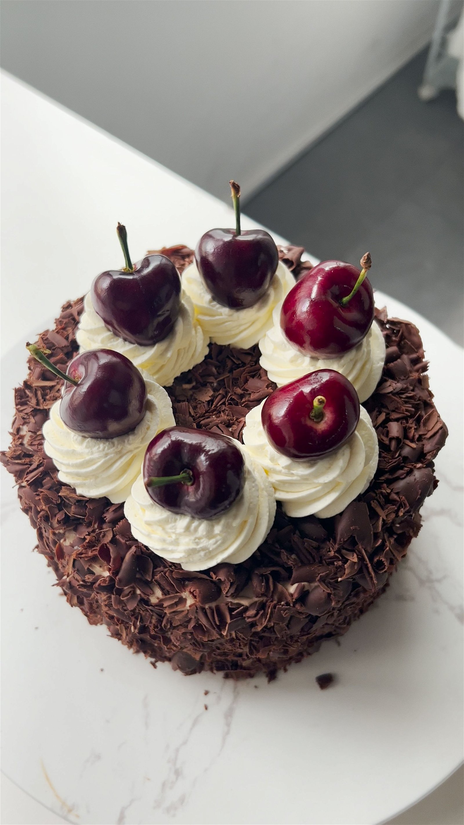 Elegant Black Forest Cake with Chocolate Shavings and Fresh Cherries.  Generative AI. Stock Illustration | Adobe Stock