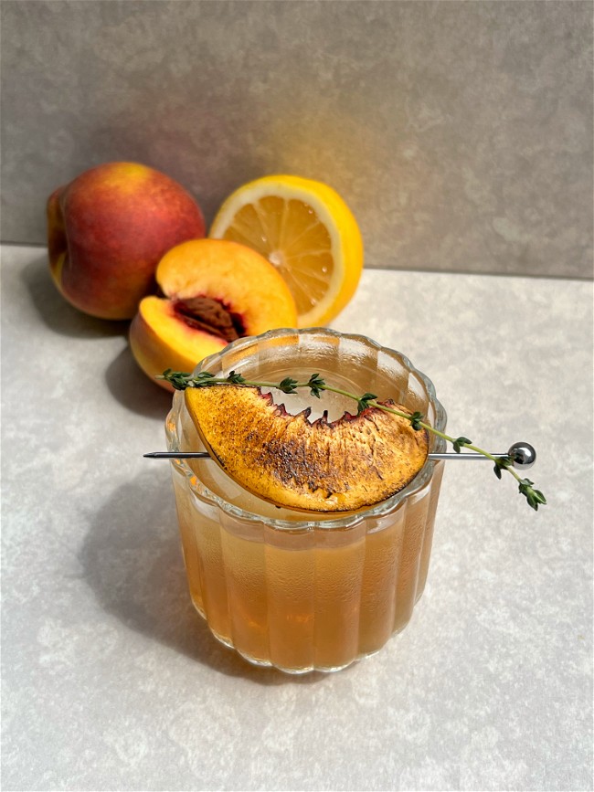 Image of Smoked Peach Maple Gold Fashioned Mocktail