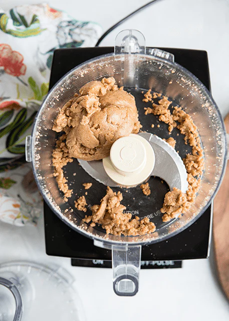 Image of In a food processor, mix together the whey, almond flour, almond butter, monk fruit sweetener, water, baking soda, and salt.