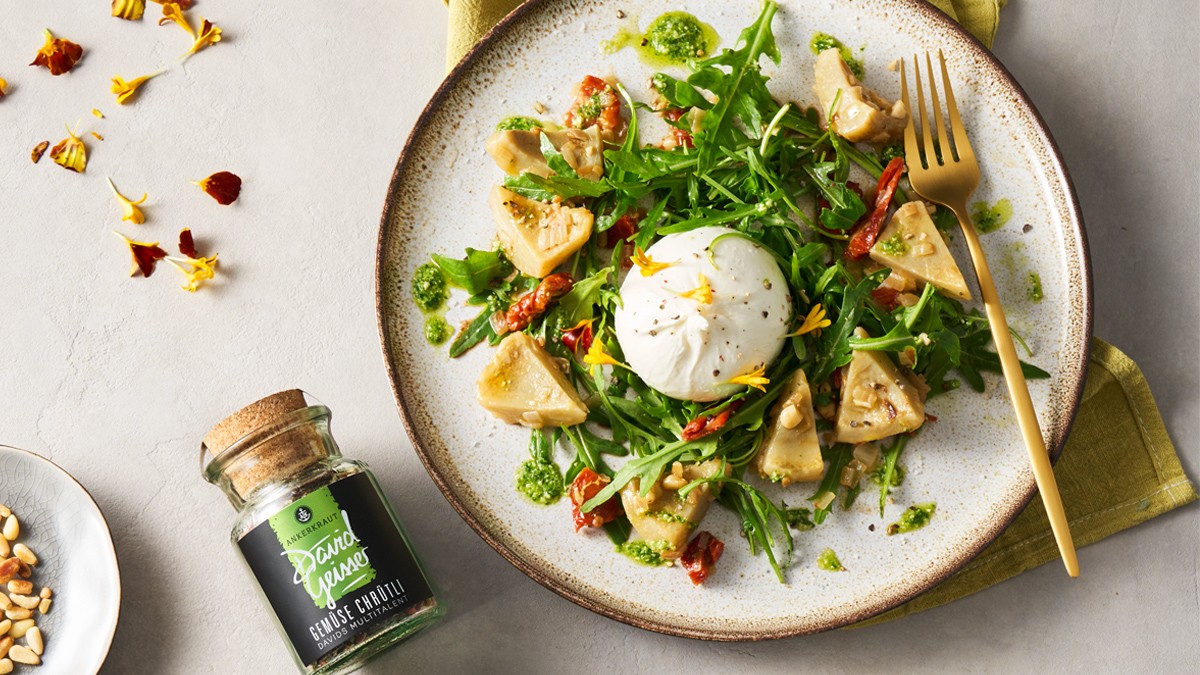 Image of Burrata mit sautierten Artischockenböden und frischem Rucola Pesto