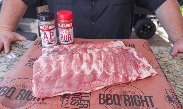 Image of Remove the membrane from each rack of ribs and trim...
