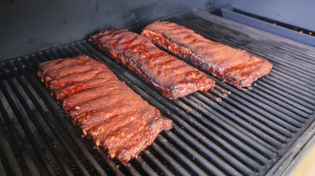 Image of Place each rack on the pit and smoke until the...