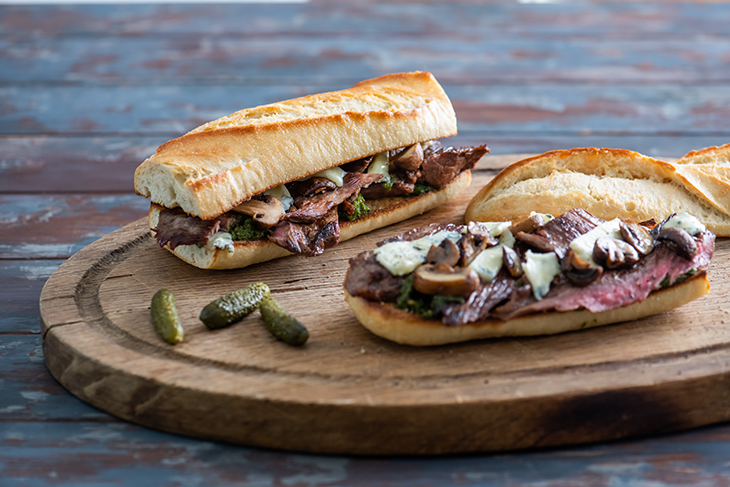 Image of Toast eight 1/2-inch thick slices olive bread. Spread 1 tablespoon leftover Blue Cheese Butter on 1 side of each bread slice. Carve leftover grilled steaks into slices; season with salt and pepper, as desired.