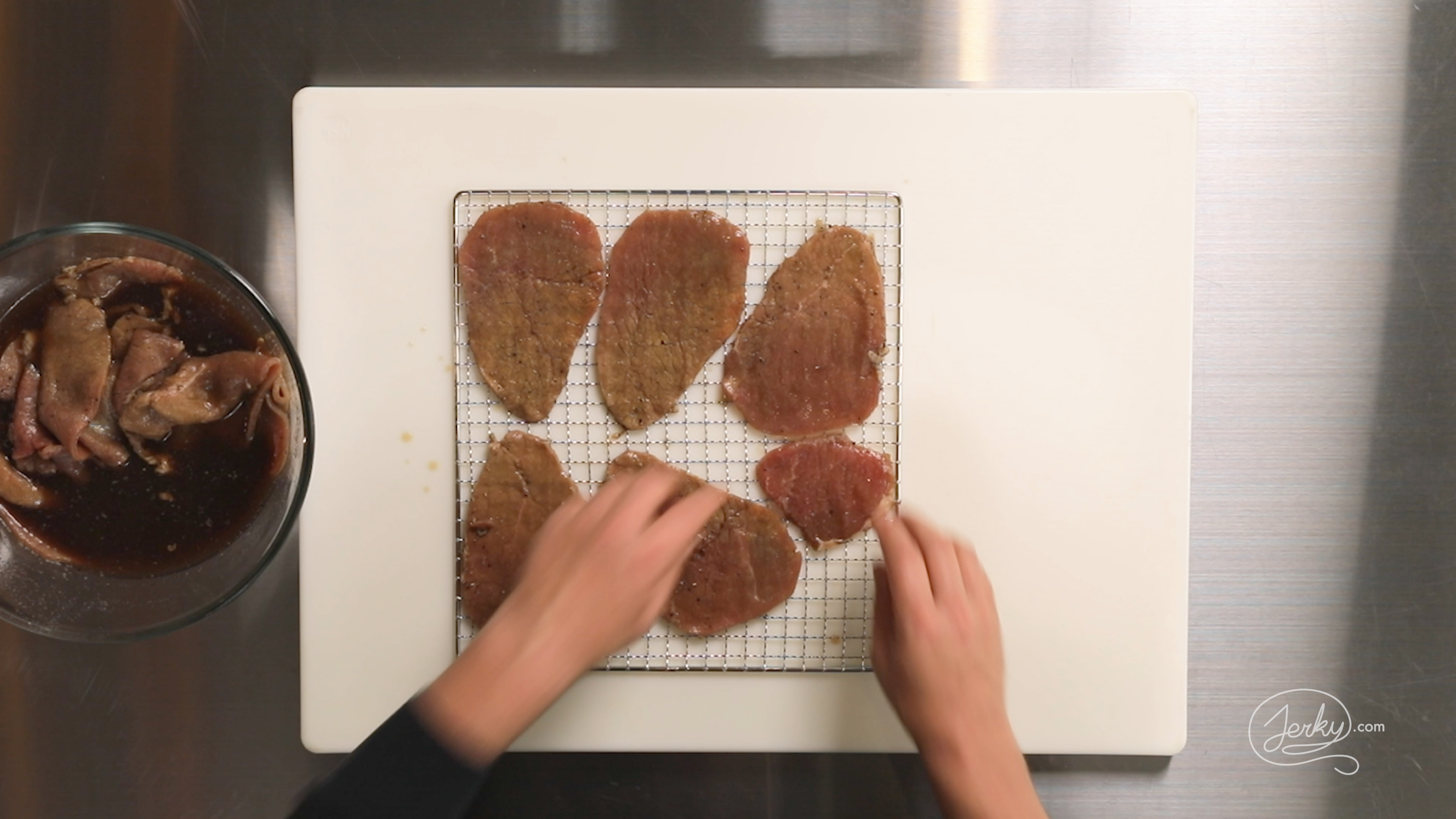 Image of After marinating, lay out the meat pieces on a dehydrator...