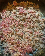 Image of Heat a large sauté pan over med/high heat and add 1 tsp. of vegetable oil, JHBMCo. ground elk, 2 tsp. salt and 1 tsp. black pepper.