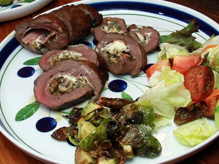 Image of Slice and serve with roasted vegetables and salad.
