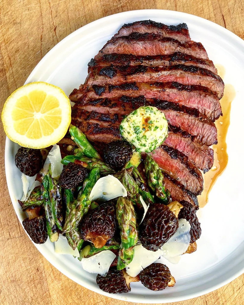 Marinated and Grilled Buffalo Flank Steak with “Caesar” Butter, Morels and Asparagus